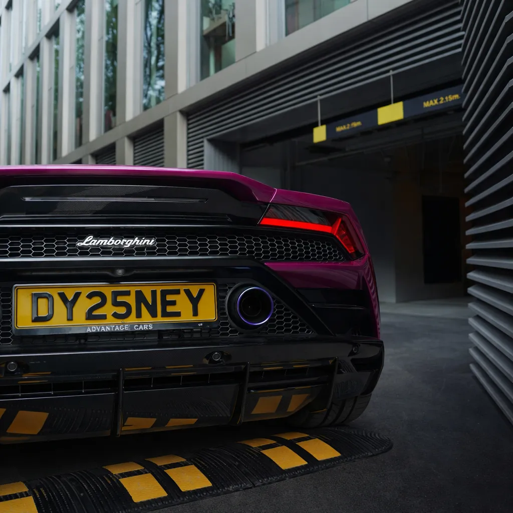Photo of a Viola Prosperina glossy pink Lamborghini Huracan supercar showing the private number plate DY25 NEY, which reads as Disney and is currently available for sale for £24,250.