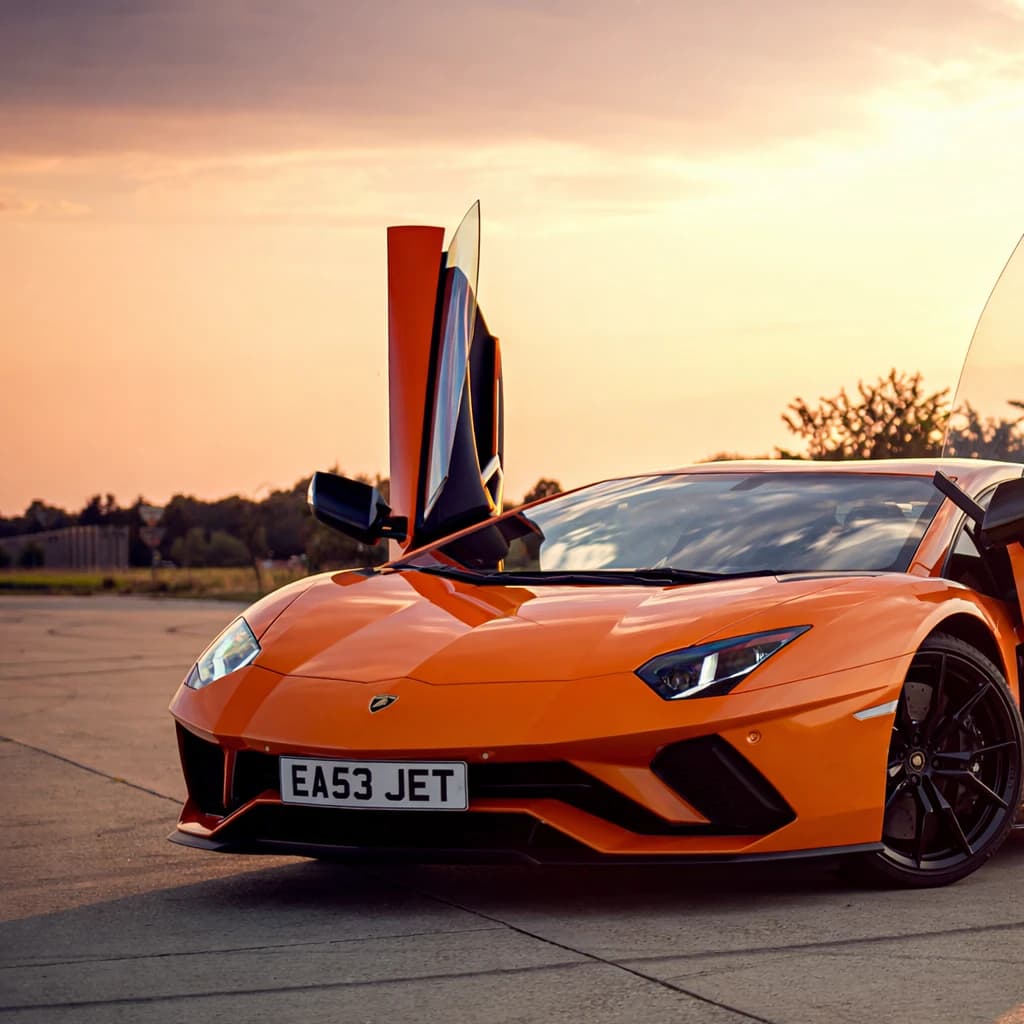Photo of an Arancio Argos Orange Lamborghini Aventador supercar showing the private number plate EA53 JET, which reads as EasyJet and is currently available for sale for £24,650.
